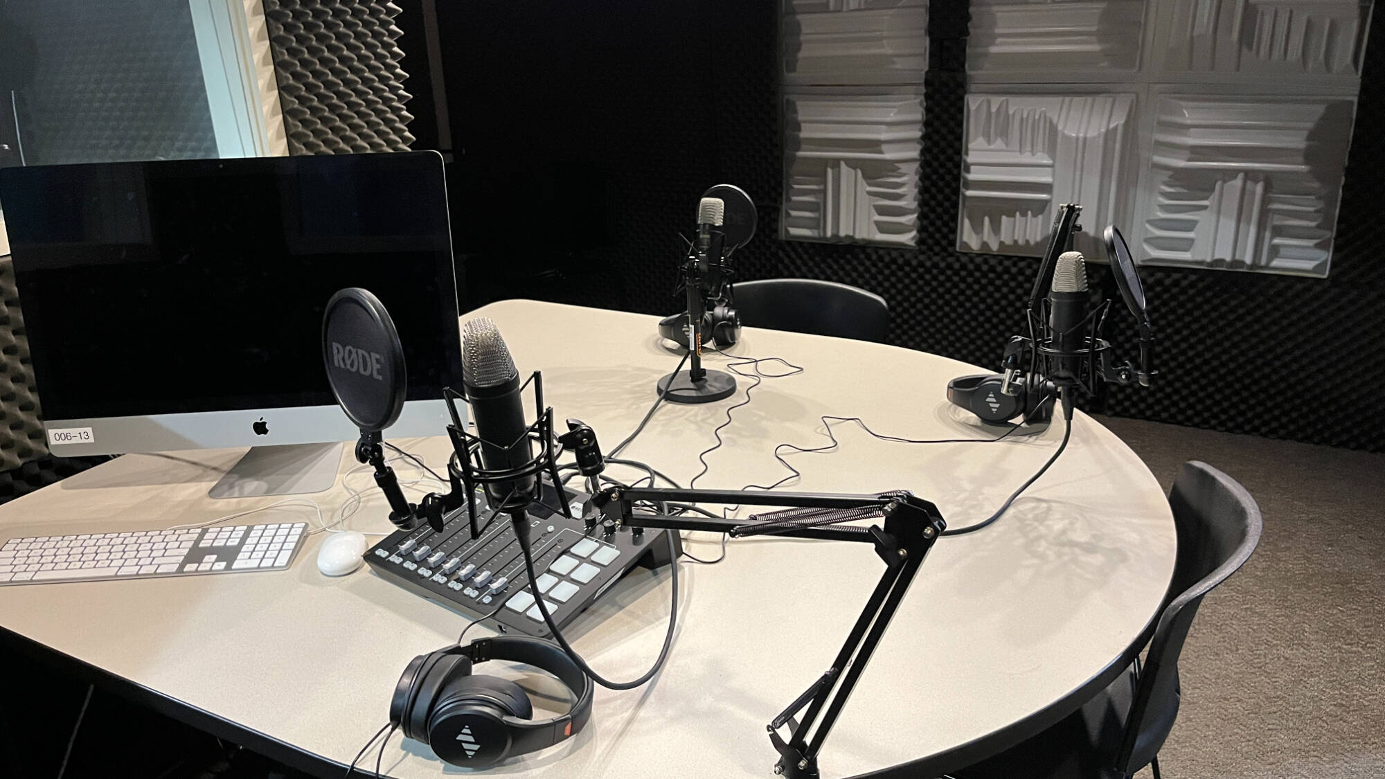 dark room with 3 mics and computer